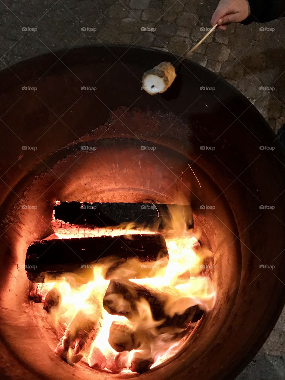 Roasting marshmallows over a bonfire