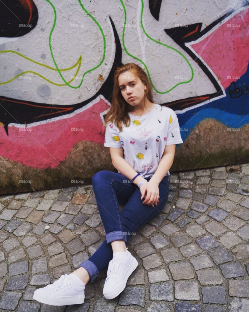 Girl near the wall.