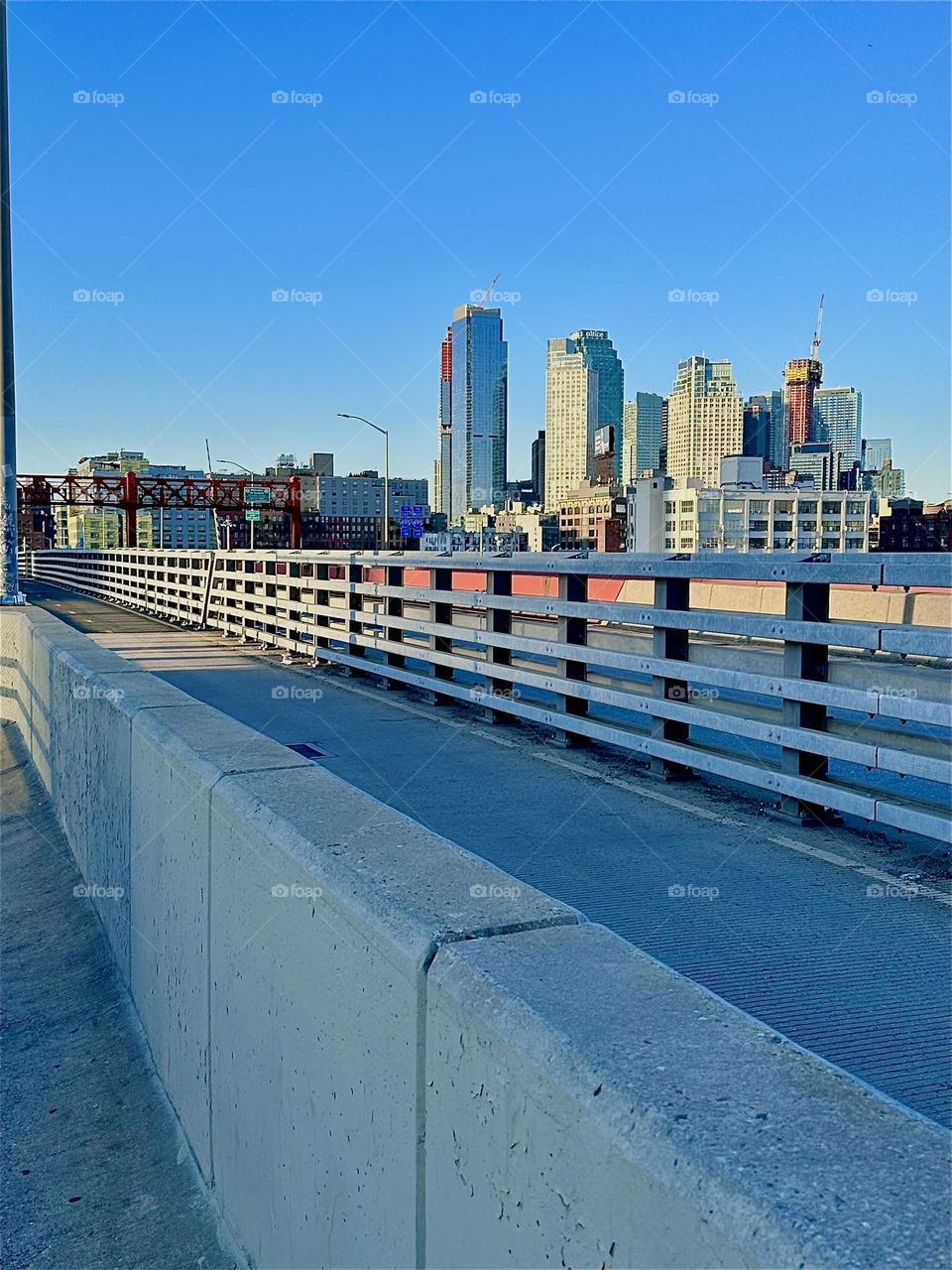 This is the pedestrian and the bicycle lane of the “Pulaski Bridge” that connects “Greenpoint”, Brooklyn to LIC, Queens in the direction we are currently facing. 2024. Hypnotic Productions