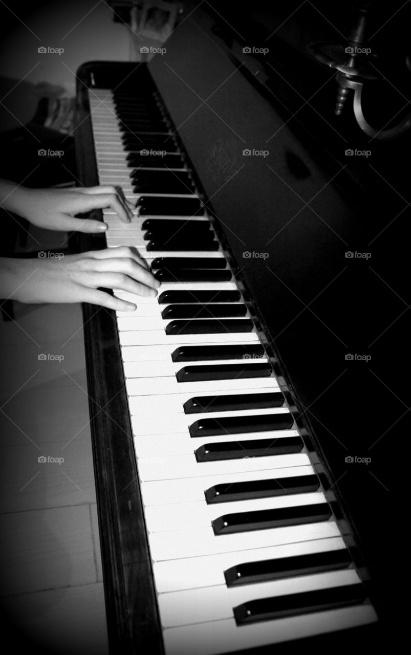 pianist hand playing piano