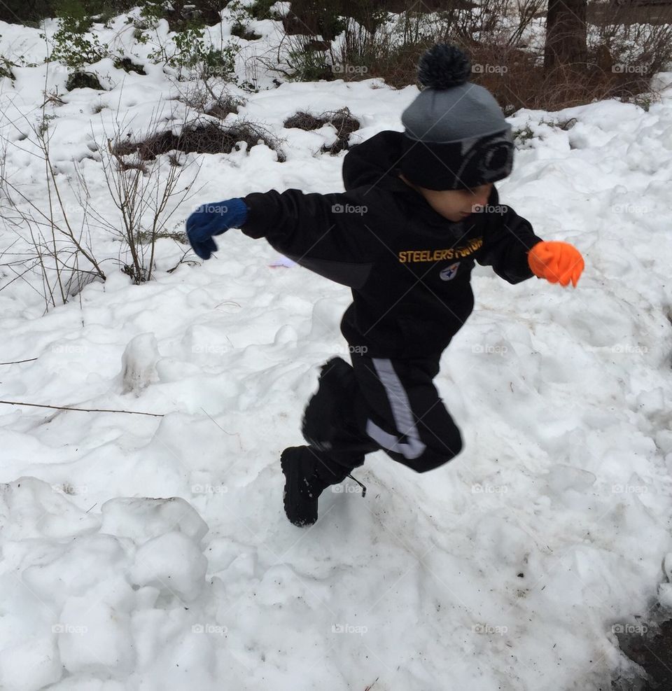 Child action running in snow