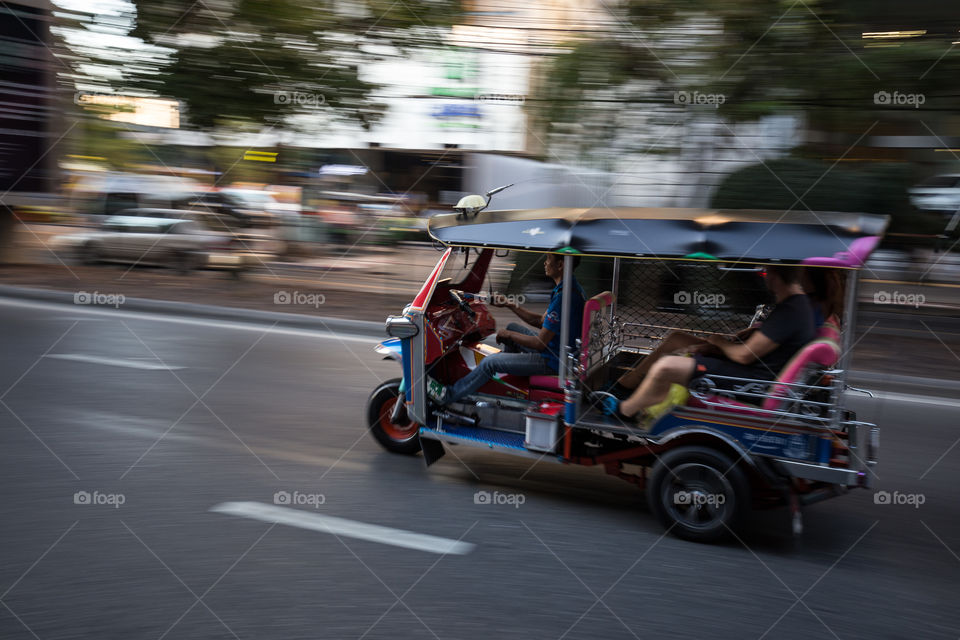 Tuk tuk taxi moving fast