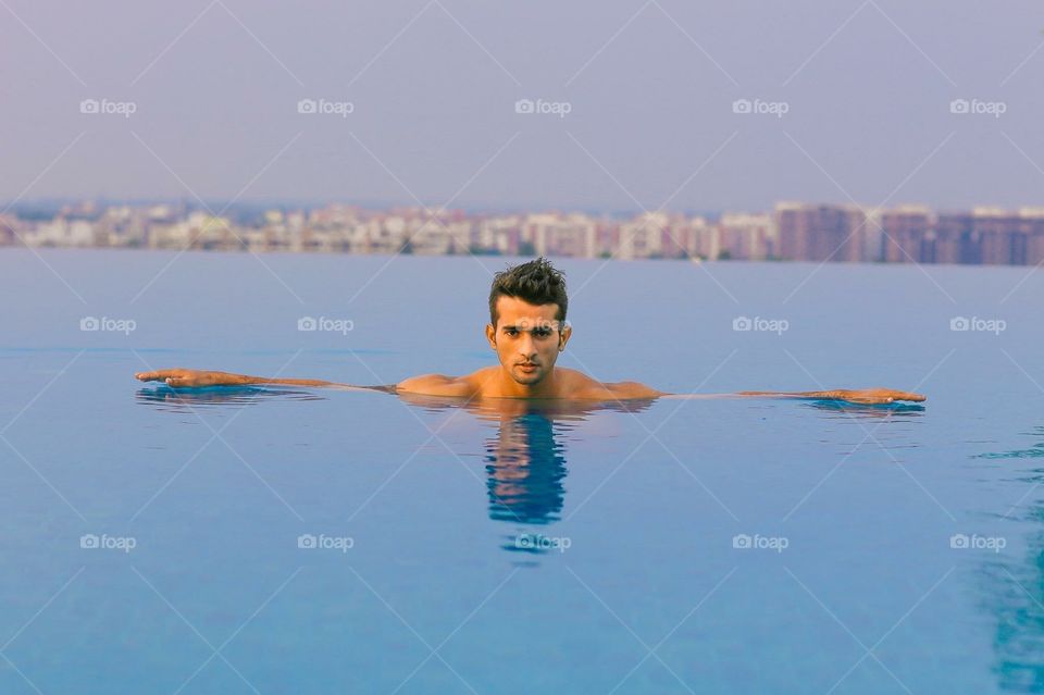 Indian model in a rooftop pool. Indian model in a rooftop pool swimming