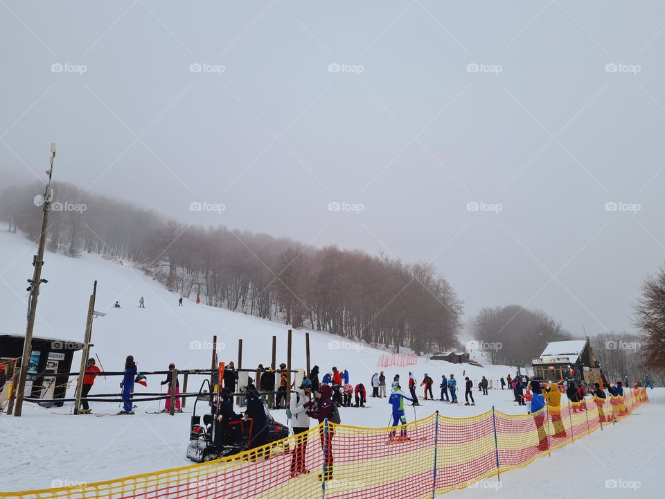 skiers queue for the ski pass