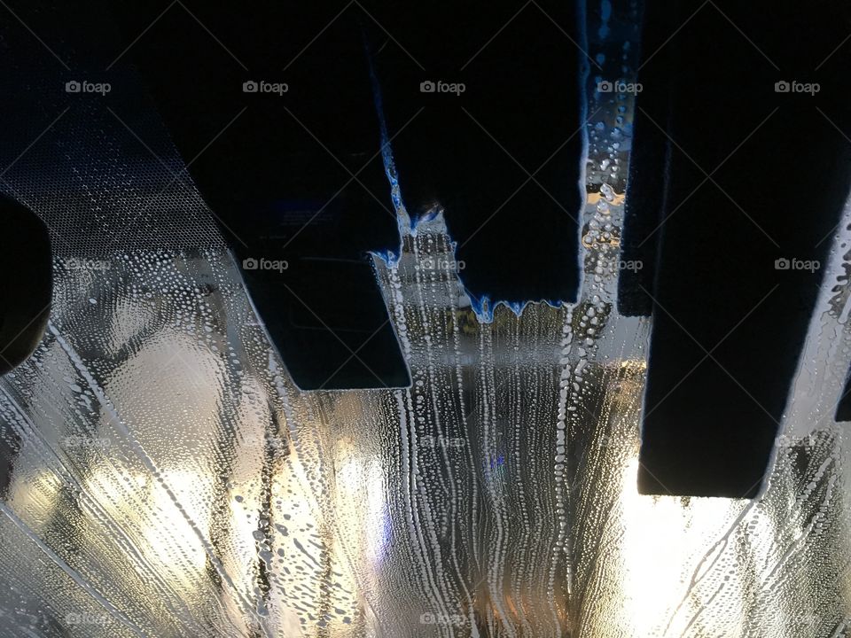 Soapy windshield in the car wash 