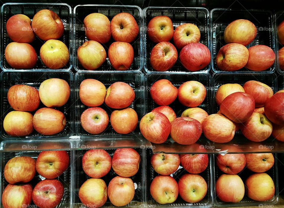 Full frame Rows of apples on shelves