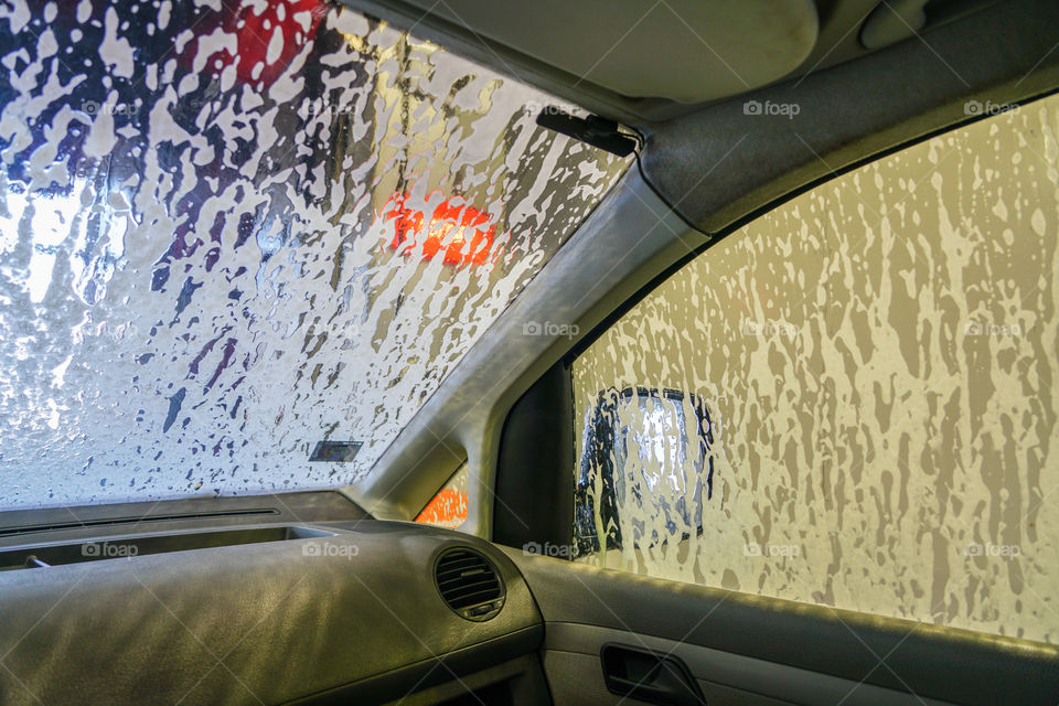 car wash, view from inside the car with foamed window