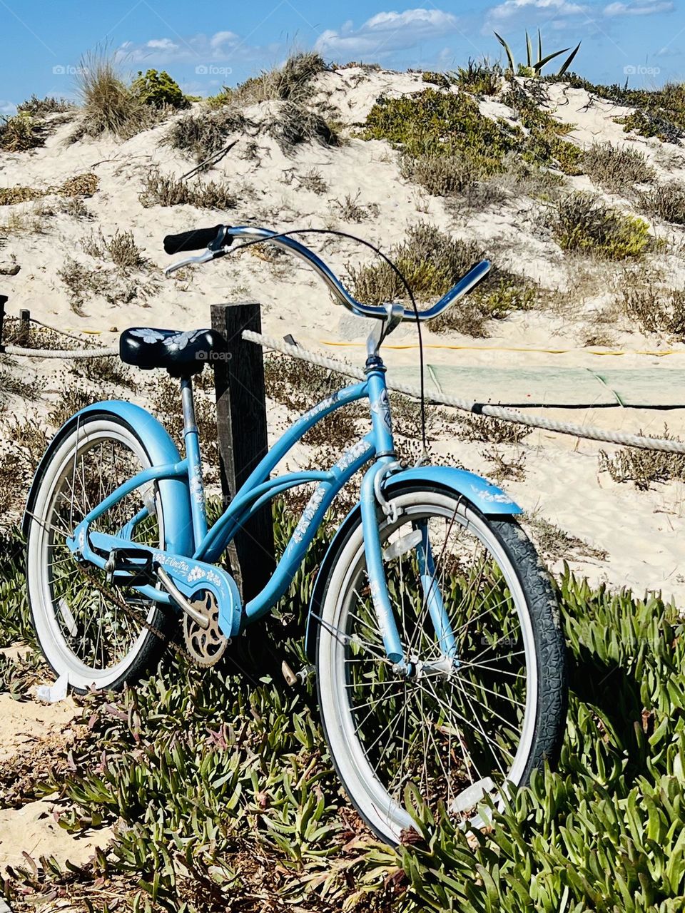 Blue bike on the beach