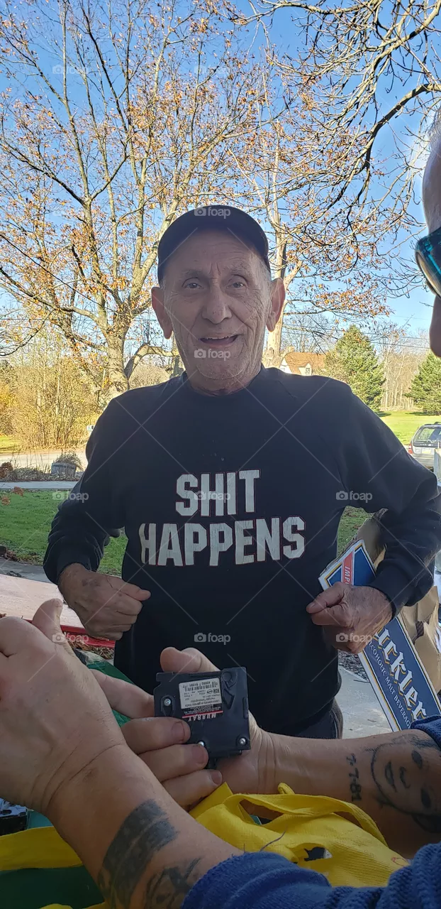 Old Man Wearing a Shit Happens Shirt