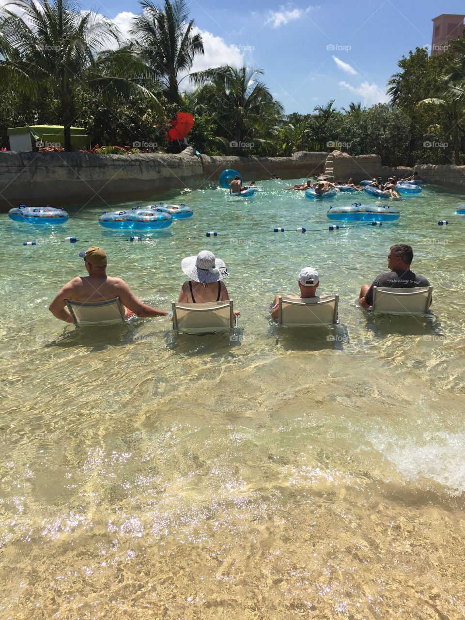 Group of people enjoying in water at park