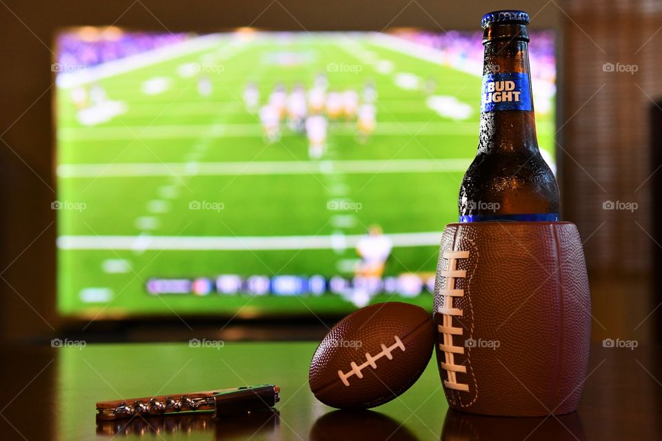 Enjoying football game night with Bud Light