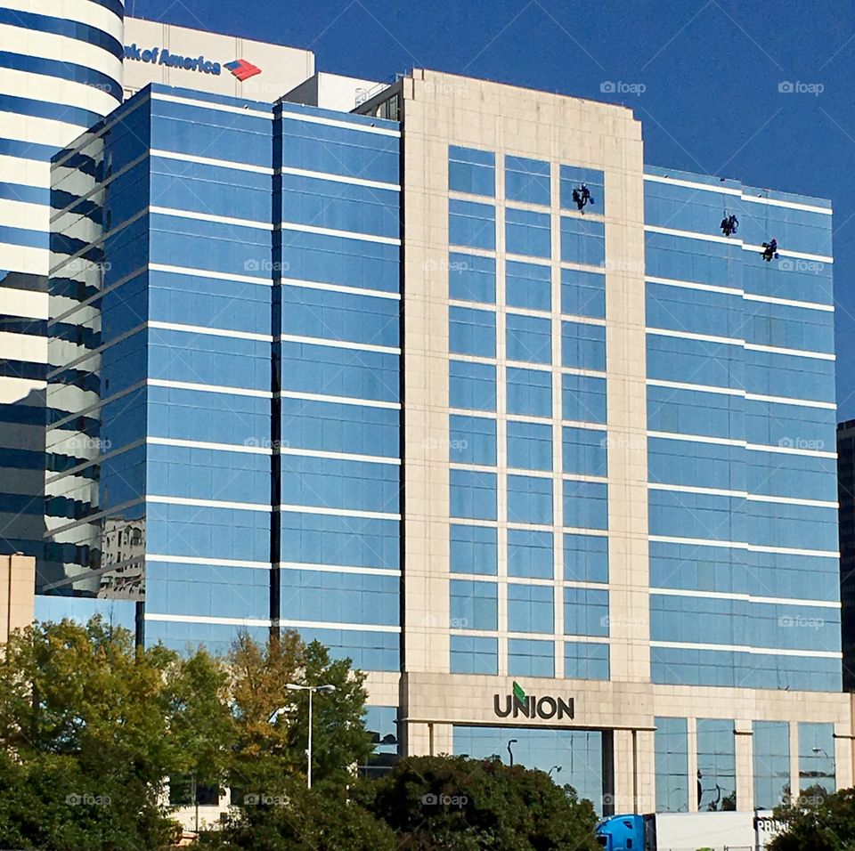 Window washers on high rise building