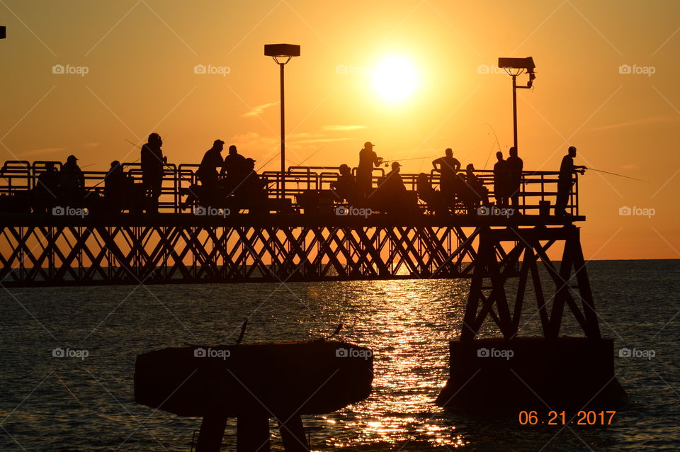 Silhouetted pier