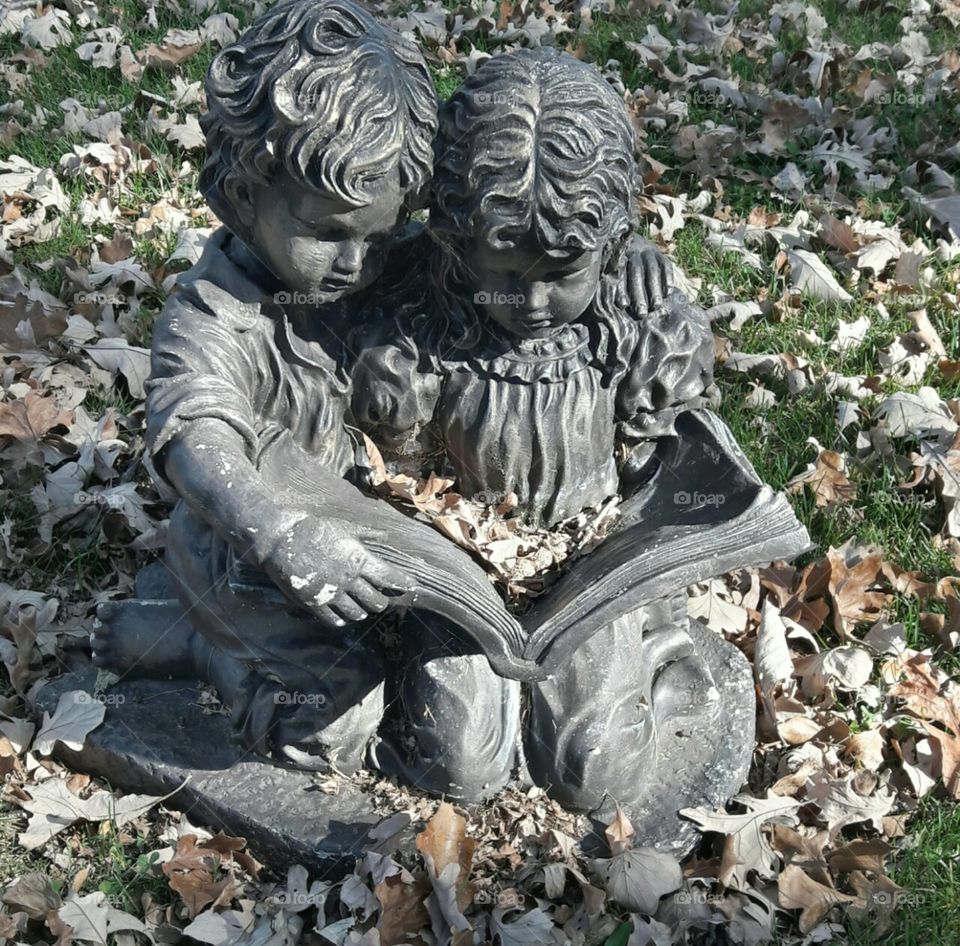 little boy and girl statue