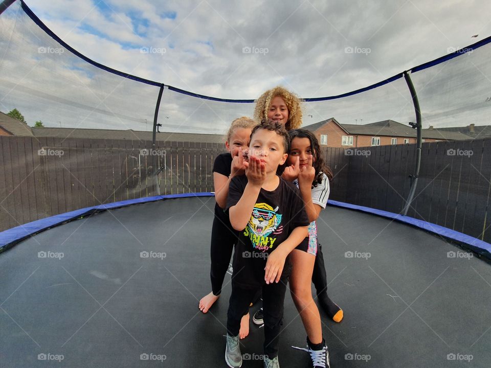Kids on the trampoline at nans house