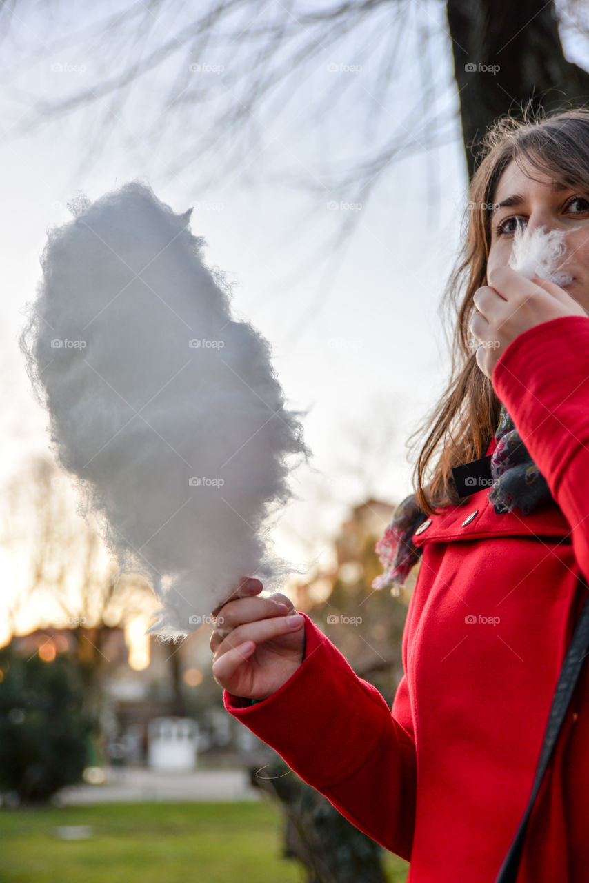 Girl eating cotton candy