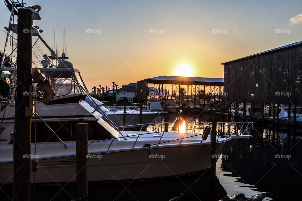 Sunset at the port with luxury yacht boat