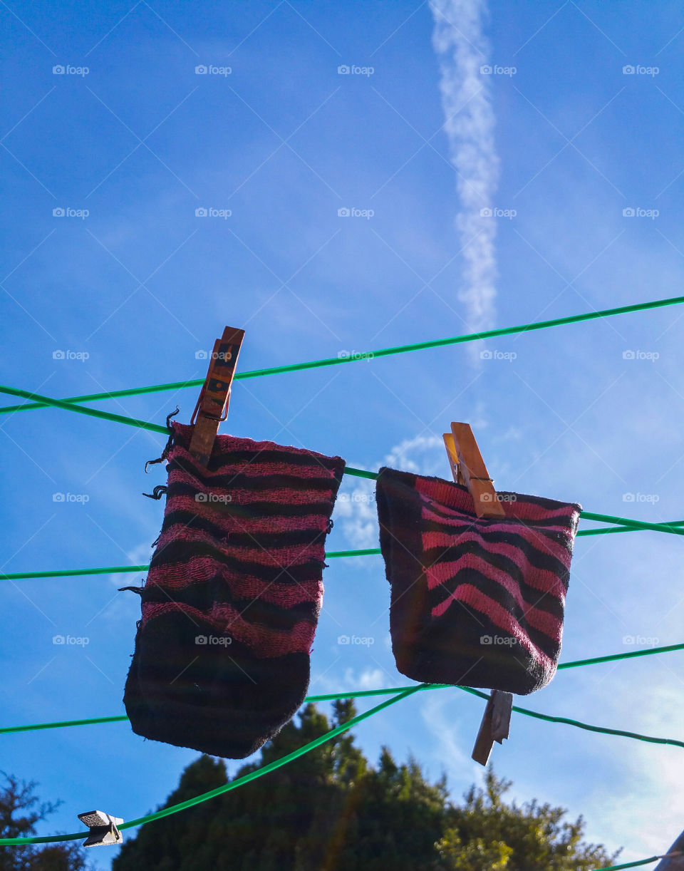 2 stripy socks on a washing line