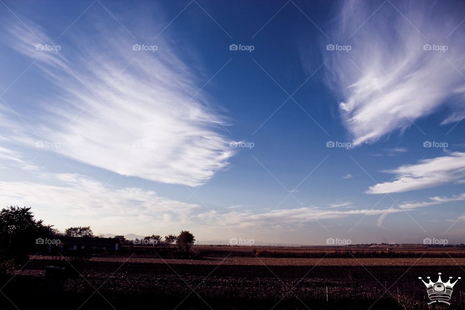 A beautifull landscape witch fluffy clouds in the Romania's sky.