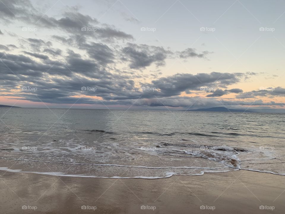 Cloudy sunrise and moon set