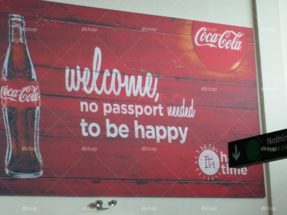 Coca-Cola  welcome painting. Going through custom in Jamaica airport  and loved the saying!