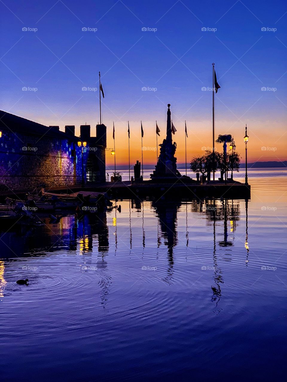 Reflection on the water Lazise Garda Lake Italy 