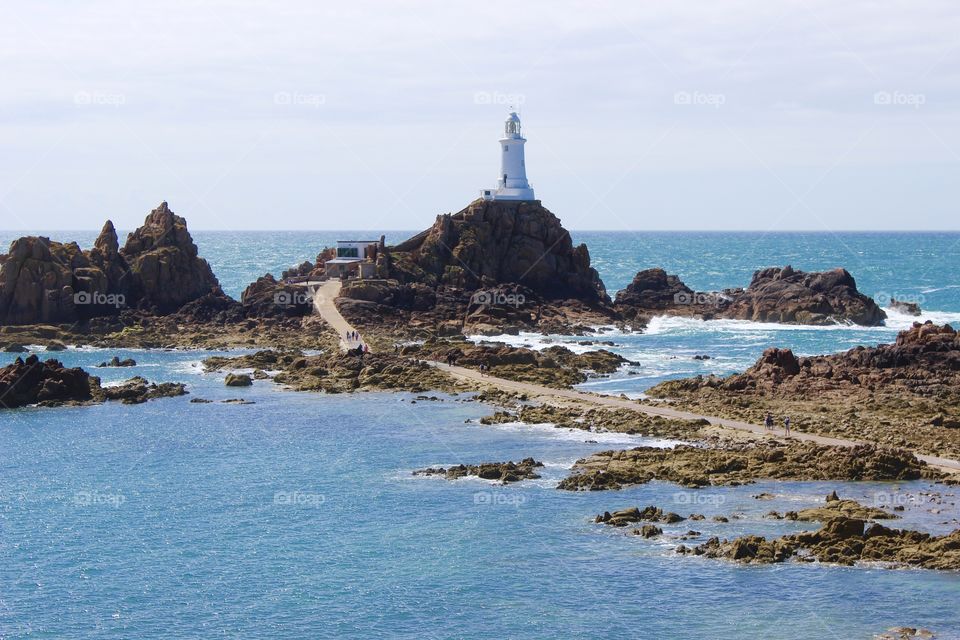 La corbière lighthouse - Jersey Channel Islands, uk. It’s a great experience to visit, you must be careful how much time you spend there and to be sure you’ll be back before the tide is high again as you have to walk from the sea pathway - Beautiful