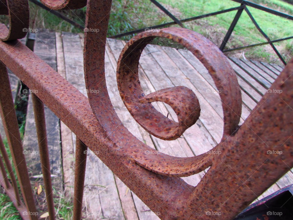 part of an old rusty iron gate