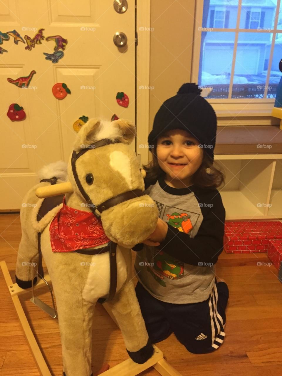 toddler and toy pony