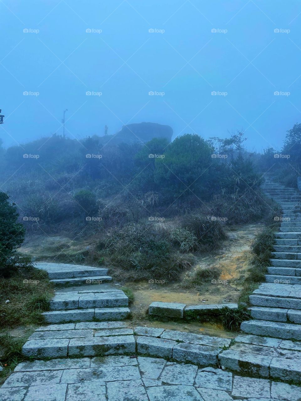 Surrounded by clouds and fog