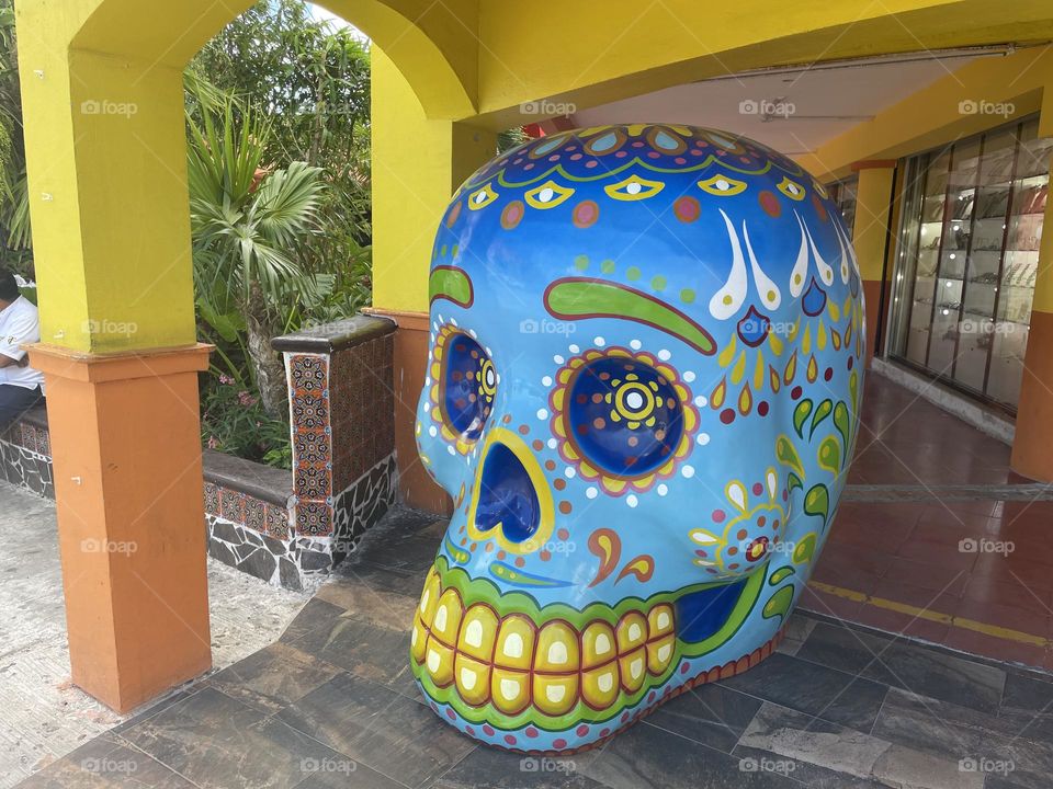 Colorful skull statue at the market Mercado 28 in Cancun downtown, Mexico.