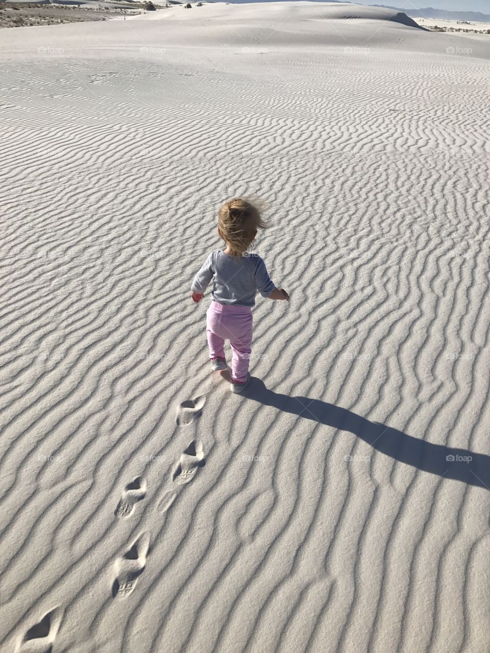 Child running in sand