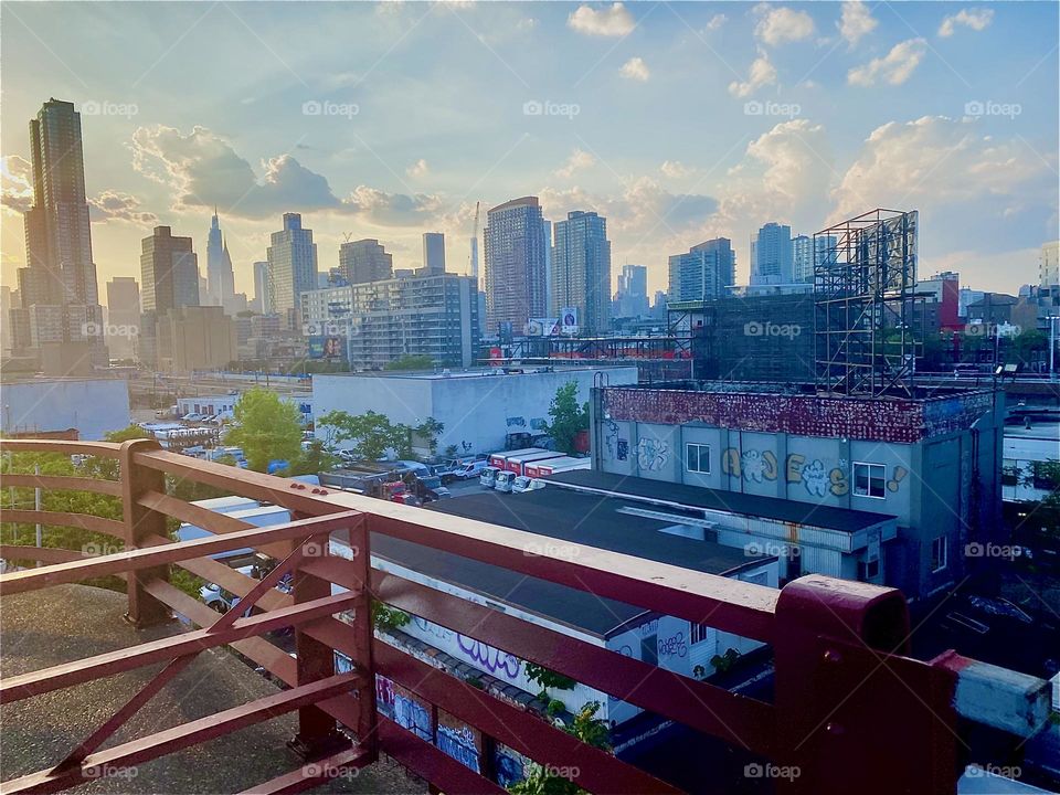 This photo was taken standing on the red metal staircase of the „Pulaski Bridge“ in LIC, Queens looking across the „East River“ at „Newtown Creek“ to „Greenpoint“, Brooklyn. 2023. Hypnotic Productions