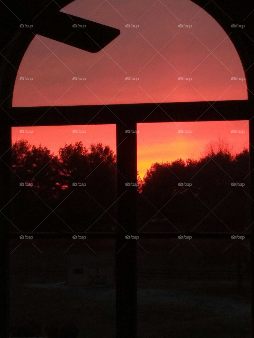 red sky in the morning through the living room window