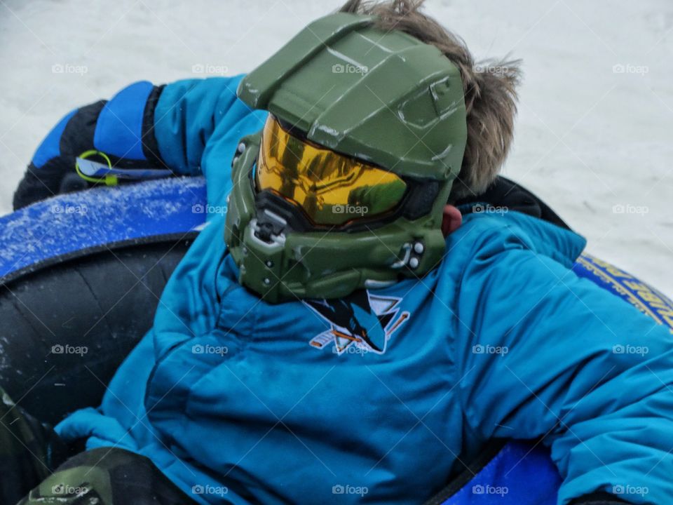 Boy On Snow Sled
