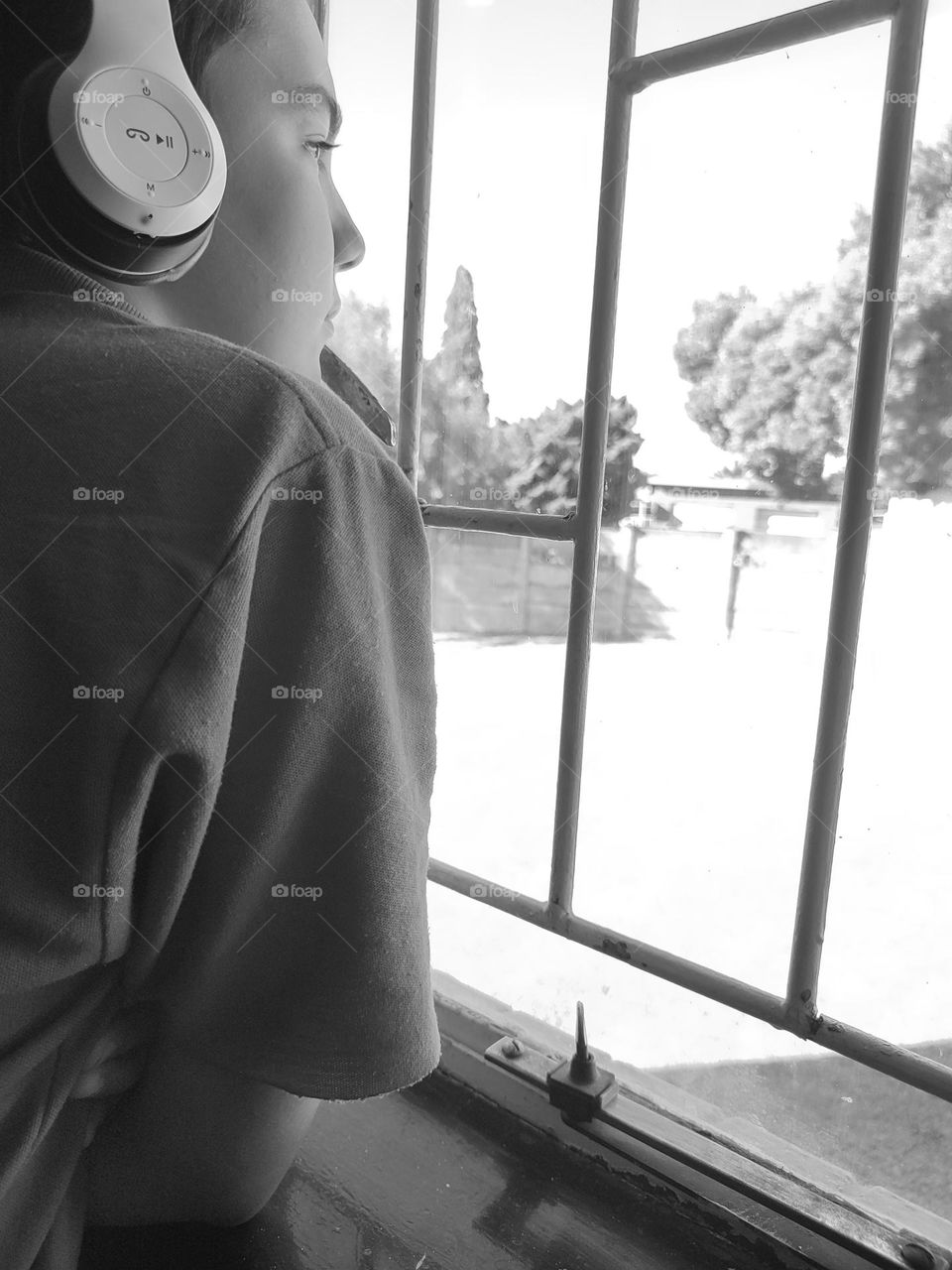 Young male looking out of the window