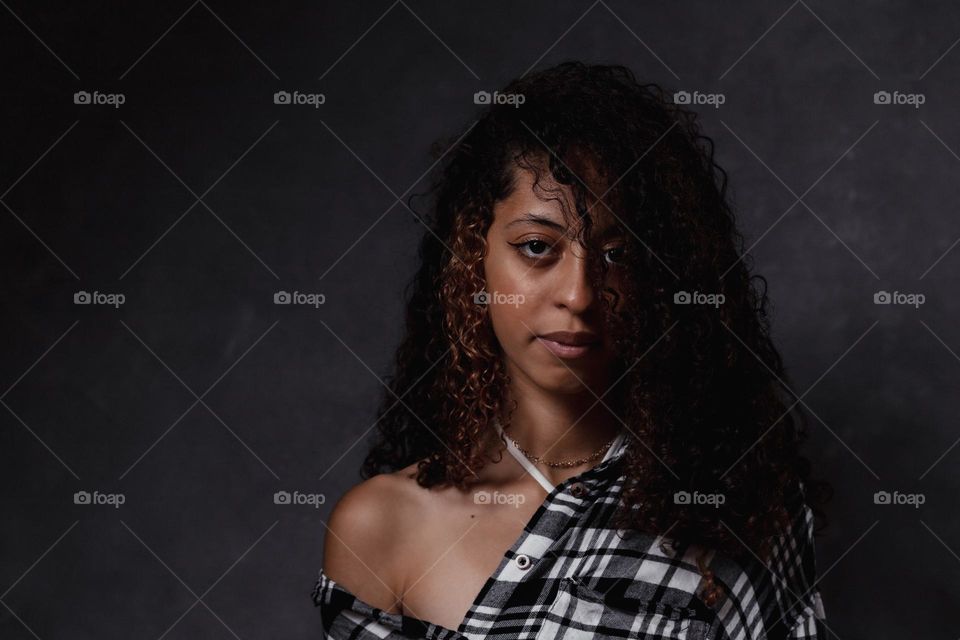 Brazilian portrait. Beautiful black curly hair