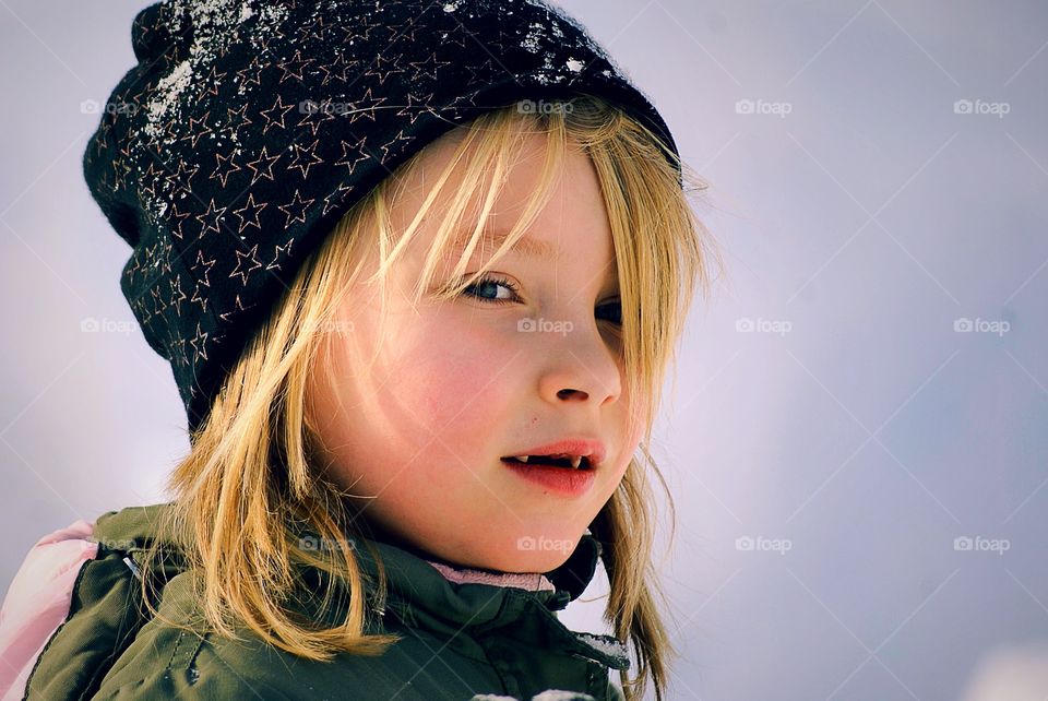 Happy girl in the snow