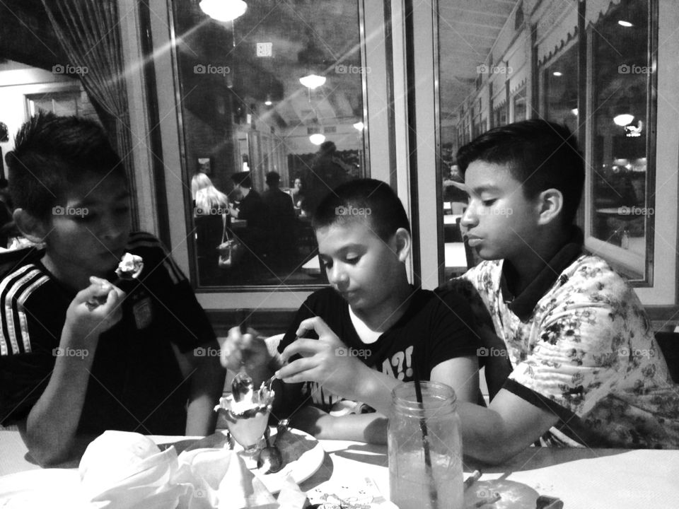 Sharing is caring. Brothers celebrating a bday and sharing a delicious ice cream at Lucile’s. 