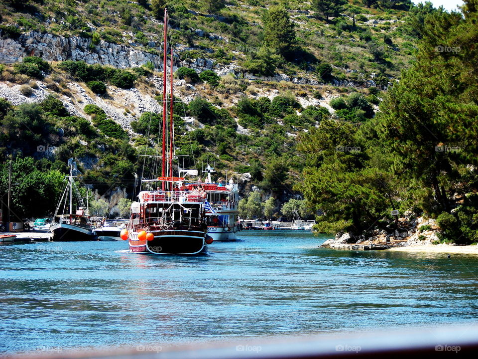 Boats moored at harbor