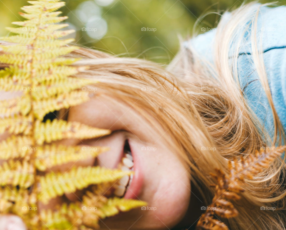 Laying among withering autumn ferns 