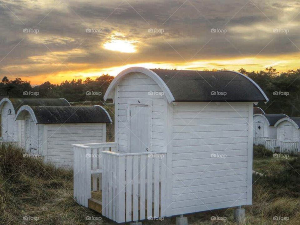 Beach huts in Winter sunset