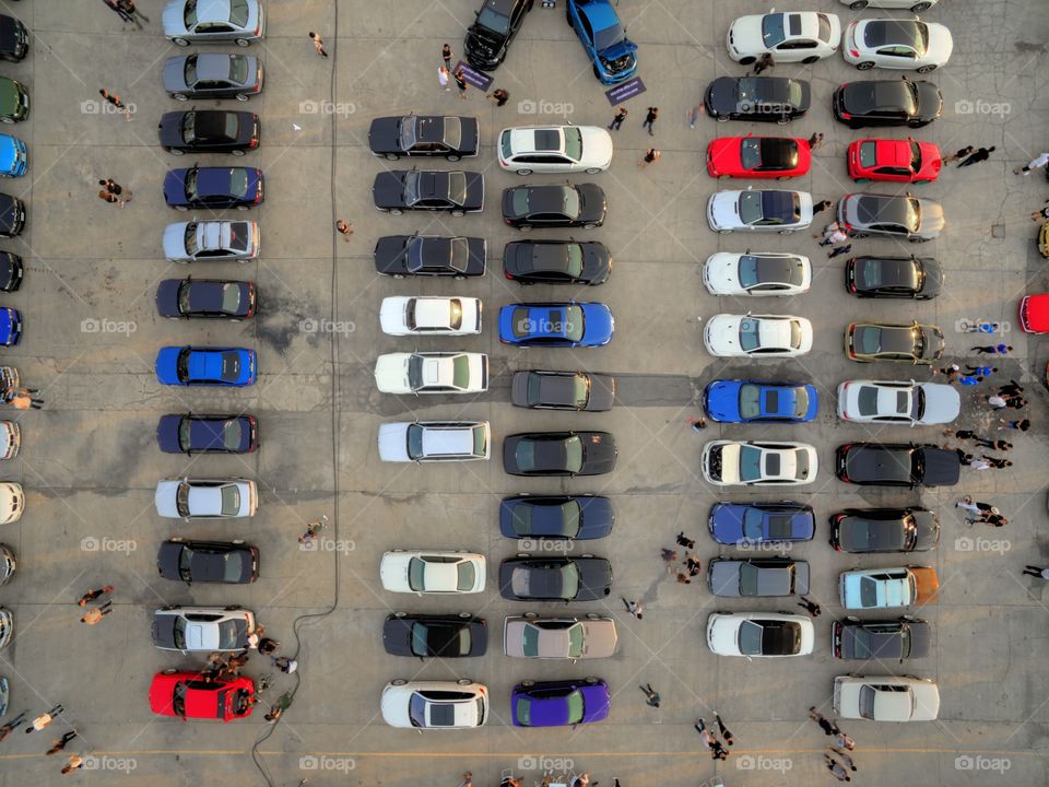 drone aerial view from above of cars parked