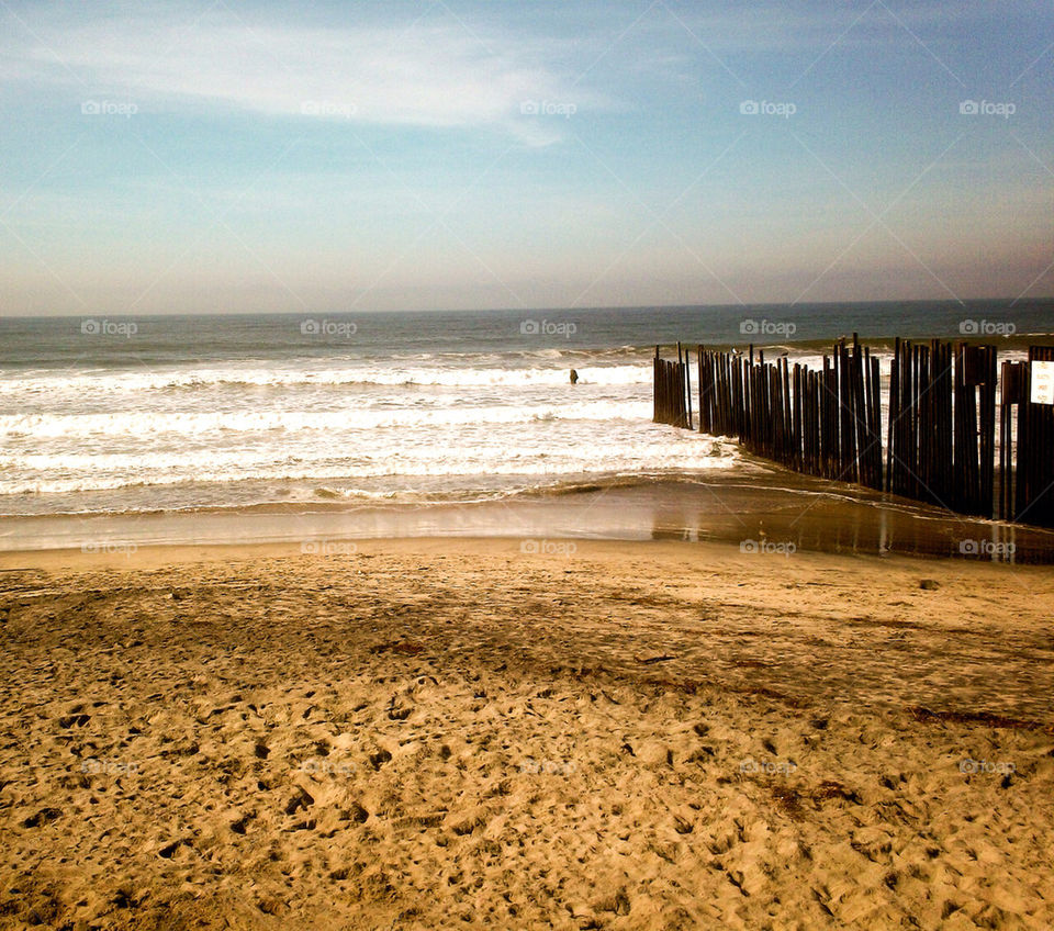 united states beach ocean fence by refocusphoto