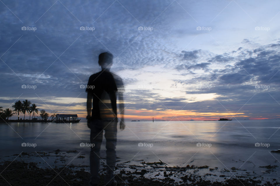 Silhouette of a man against sunset