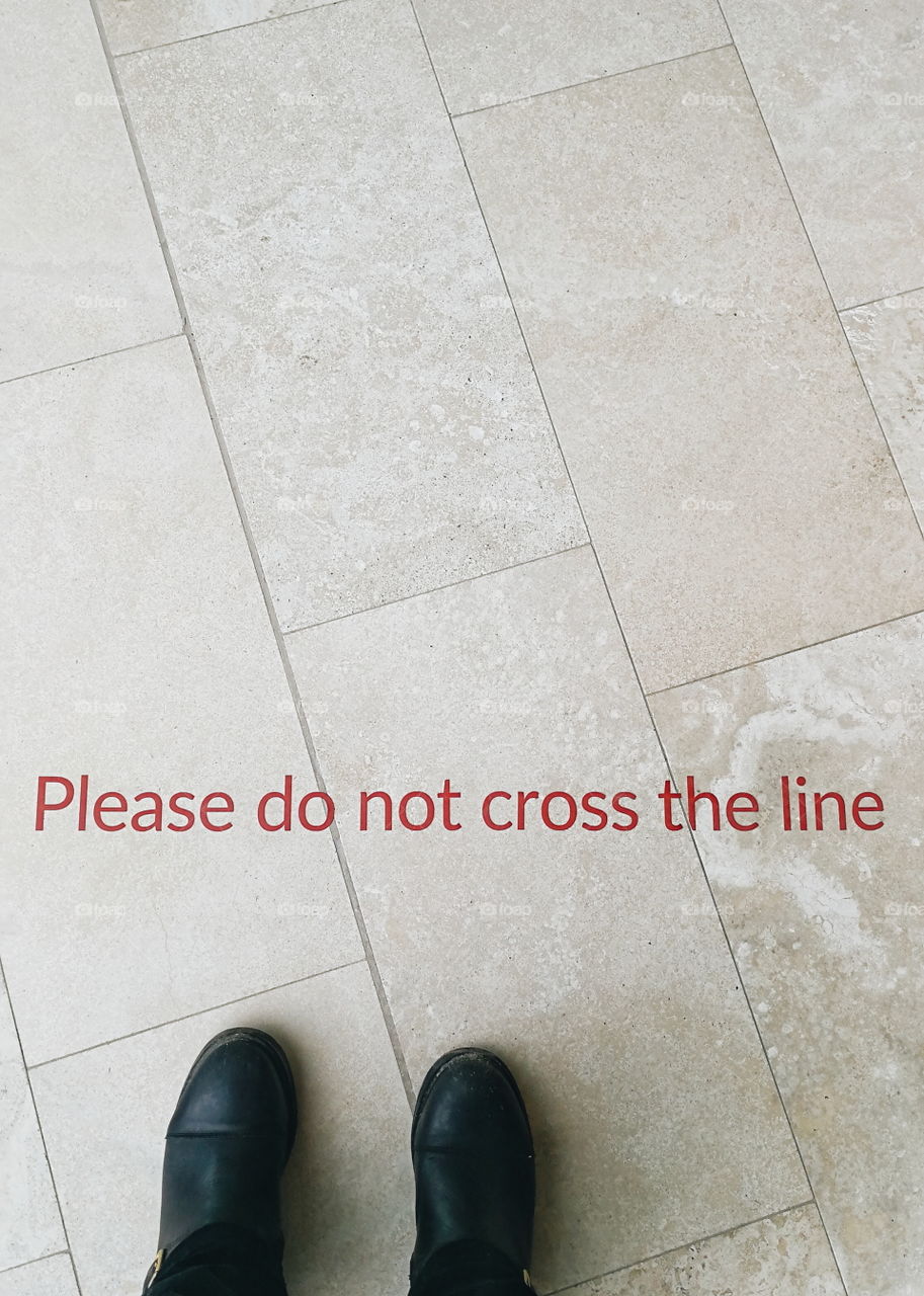 "Please do not cross the line" quote on the floor