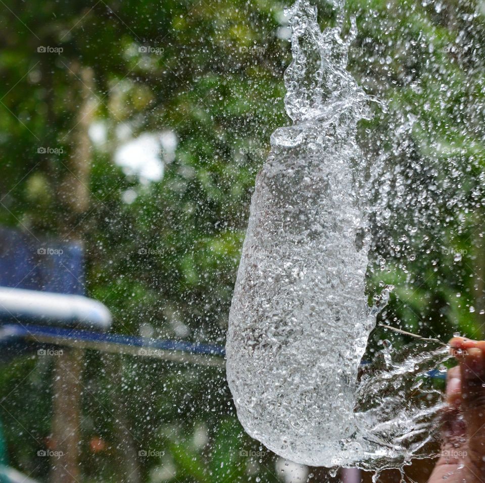 Person throwing water balloon