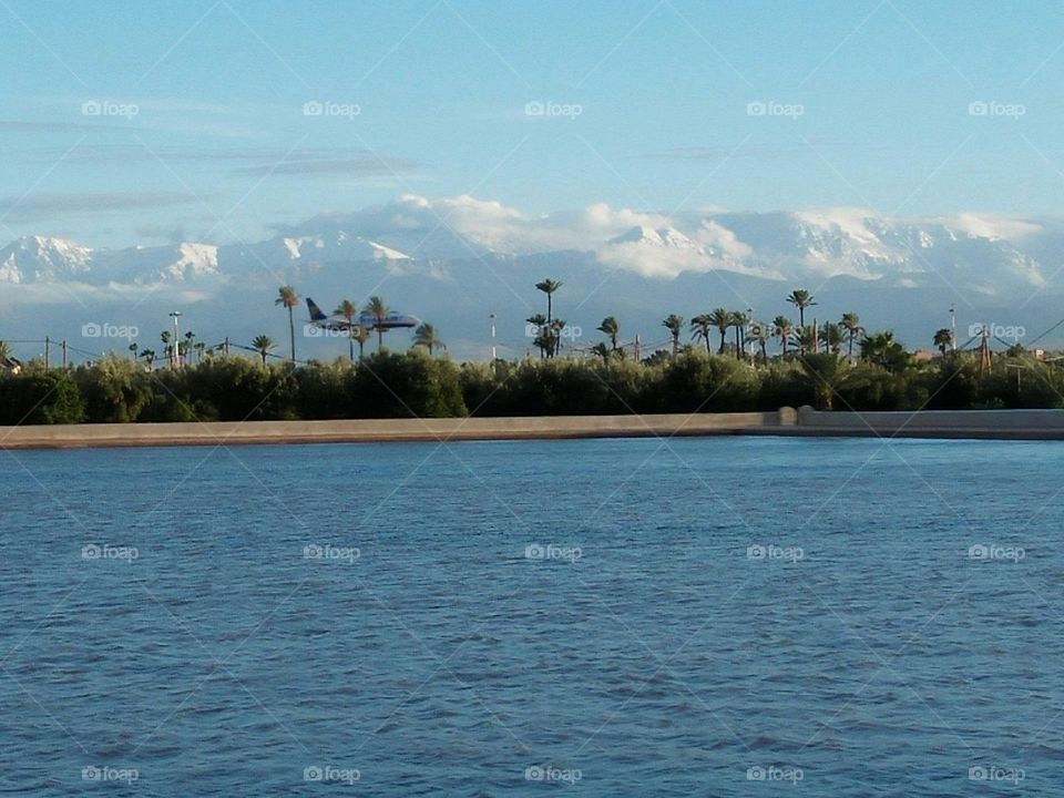 Beautiful landscape at marrakech city in Morocco and beautiful airplane in the sky.