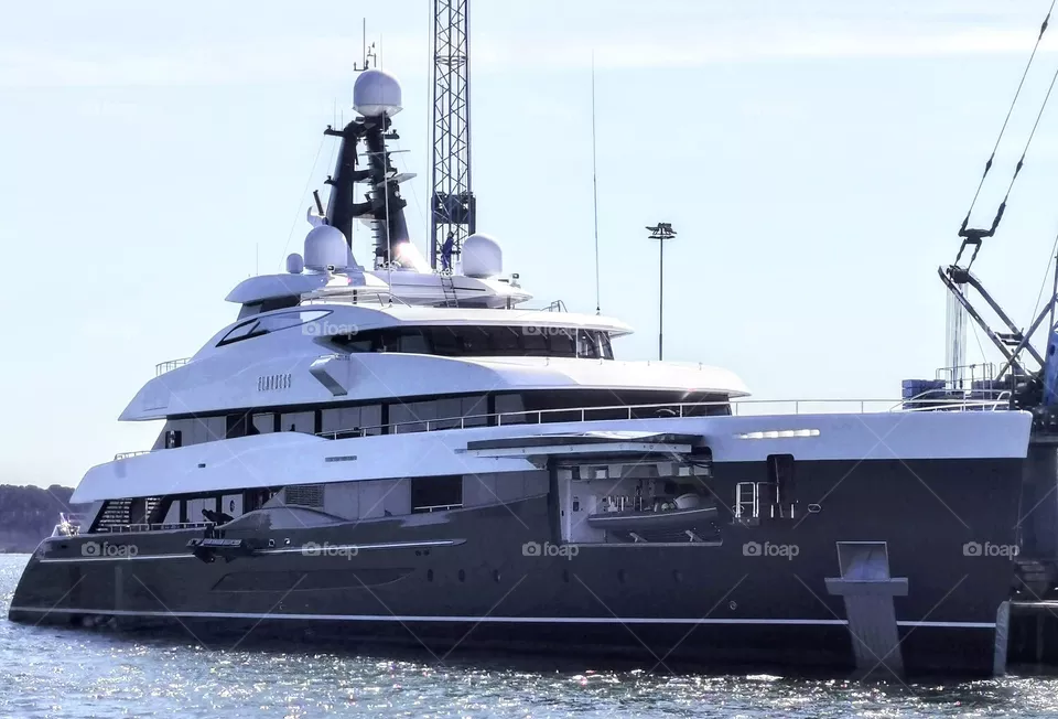 Superyacht Elandess mooring in Poole Harbour with her doors open for the Main Deck tender boat storage