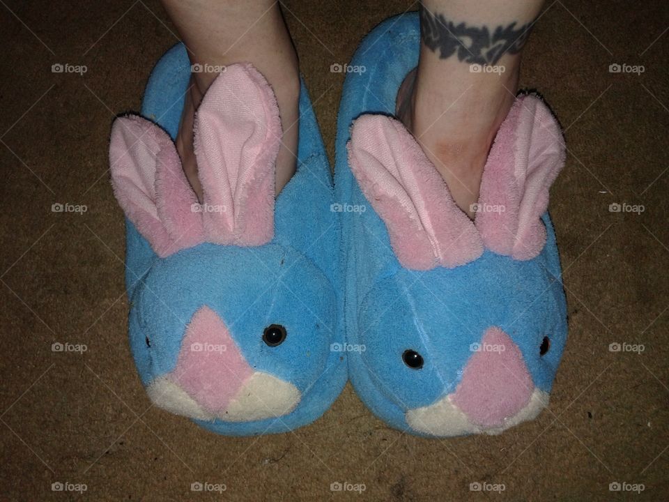 bunny slippers and a tattoo